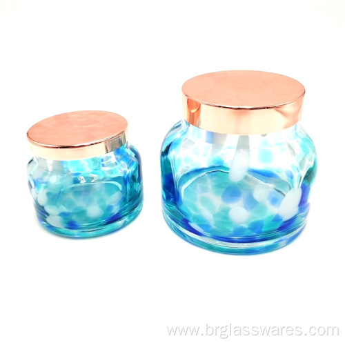 Swirled spots glass candle holder with metal lid